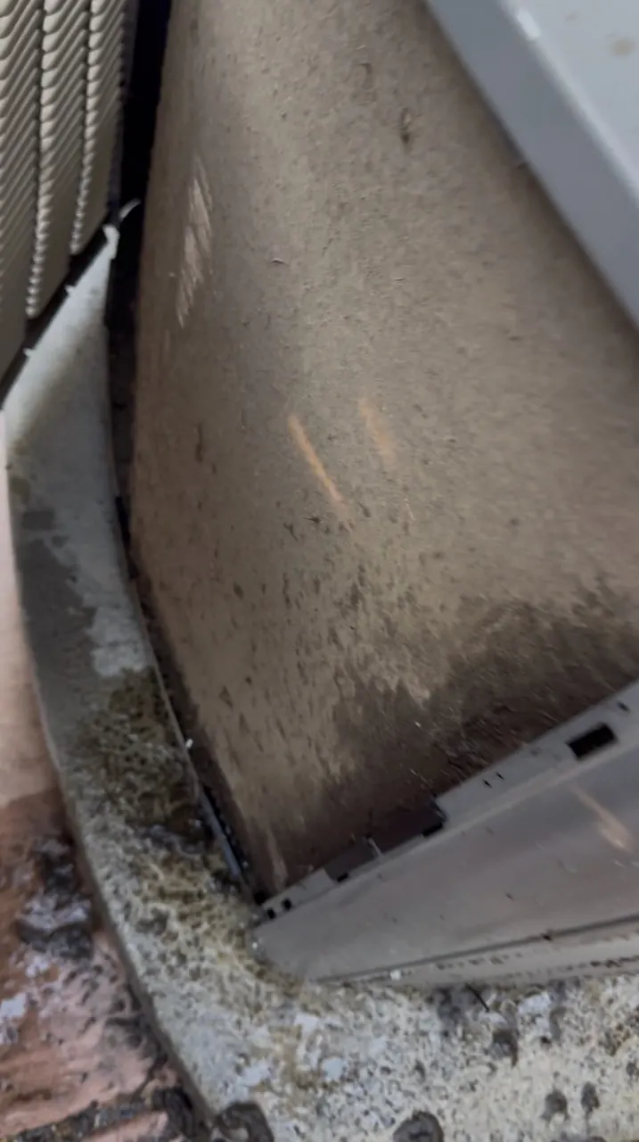 Heavy dirt buildup blocking the condenser coil on an older R-22 air conditioner in Auburn, California