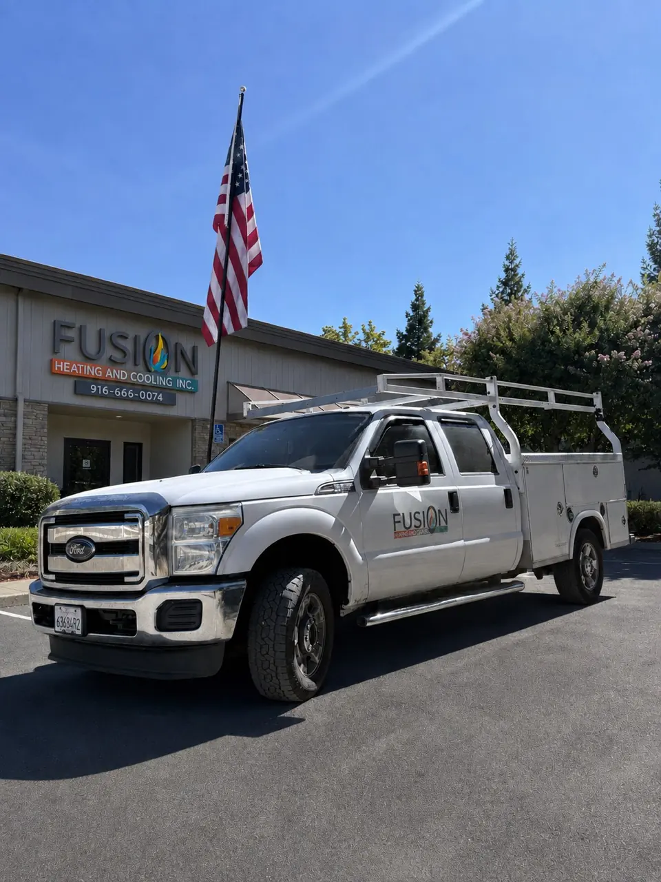 Fusion Heating and Cooling service truck outside the company office