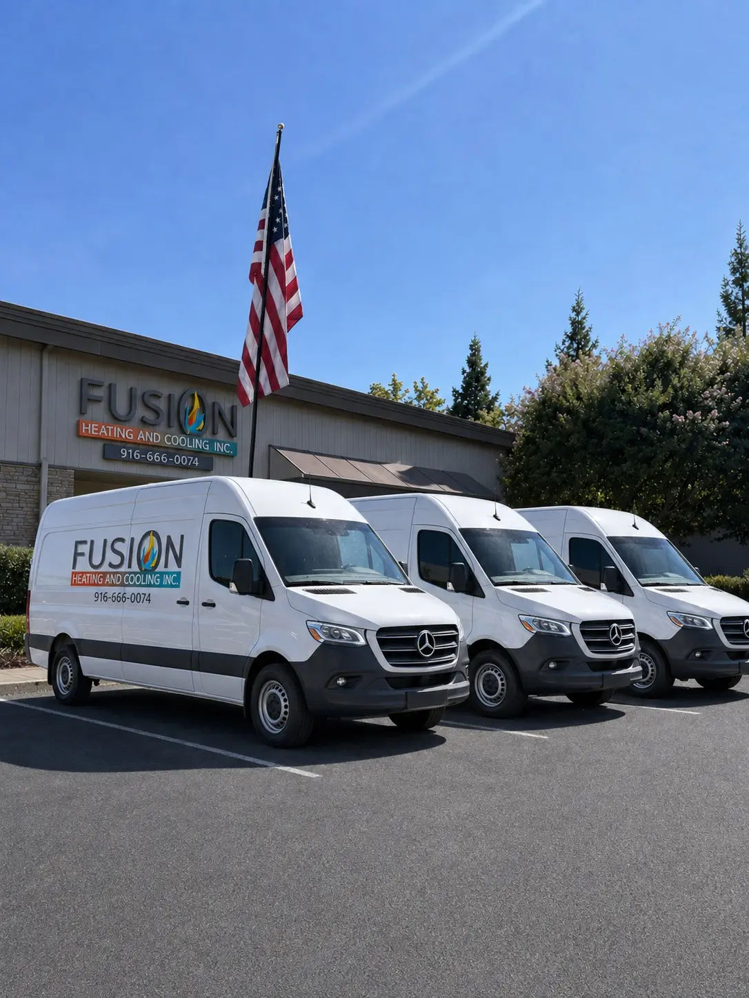 Three Fusion Heating and Cooling service vans outside the company office