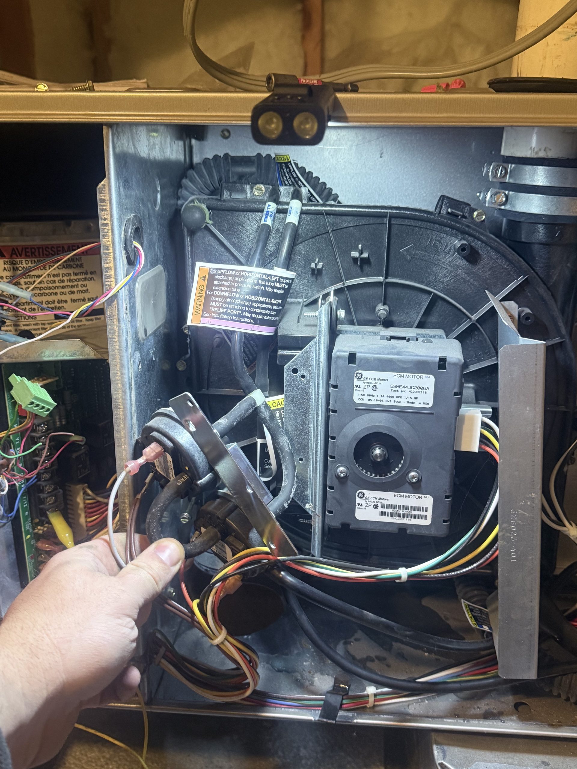 Furnace inducer assembly and pressure switches during a repair in Lahontan, Truckee