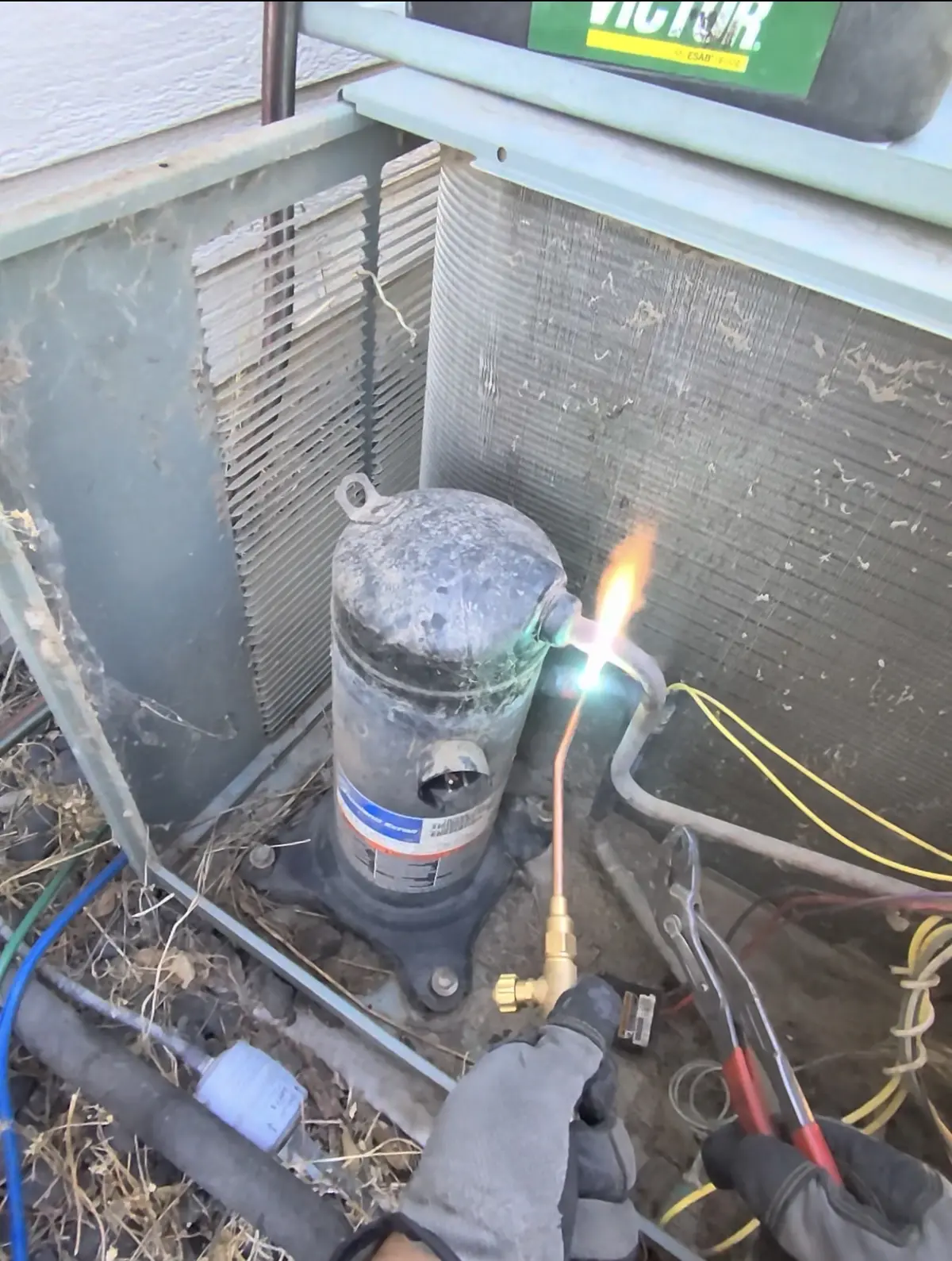 Technician disconnecting the old AC compressor in Lincoln, CA