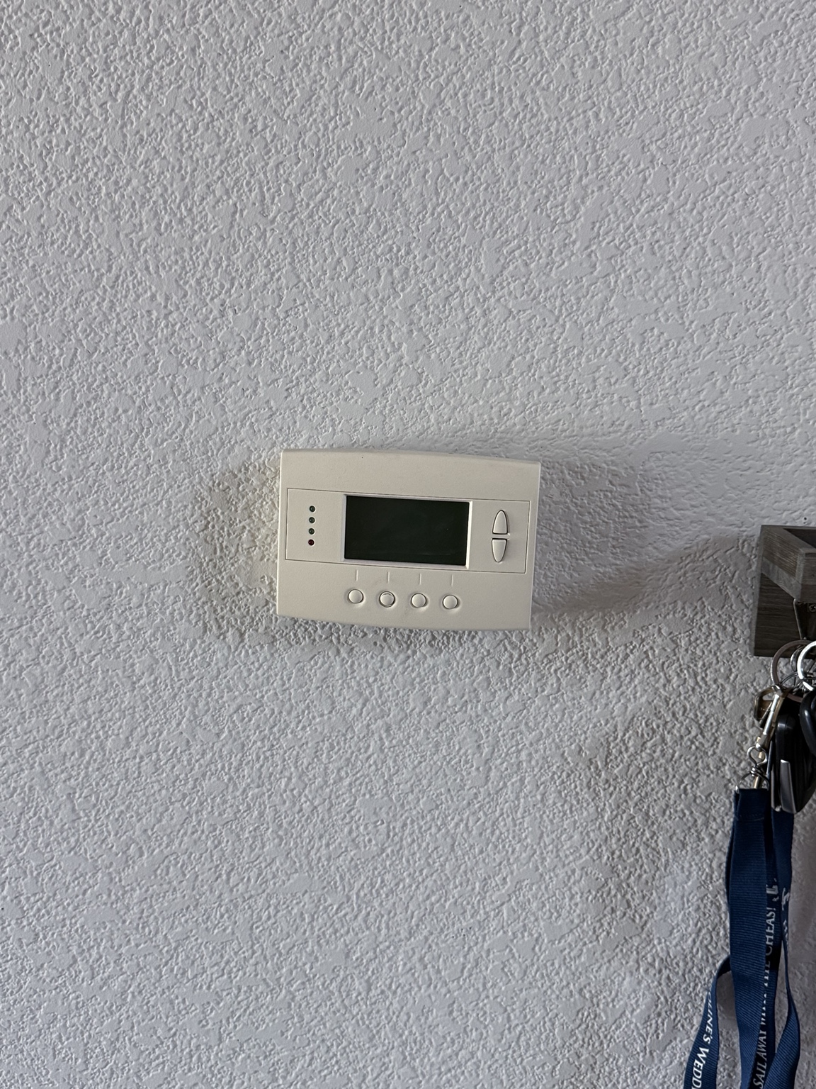 Existing wall thermostat before replacement in a Gray’s Crossing home in Truckee
