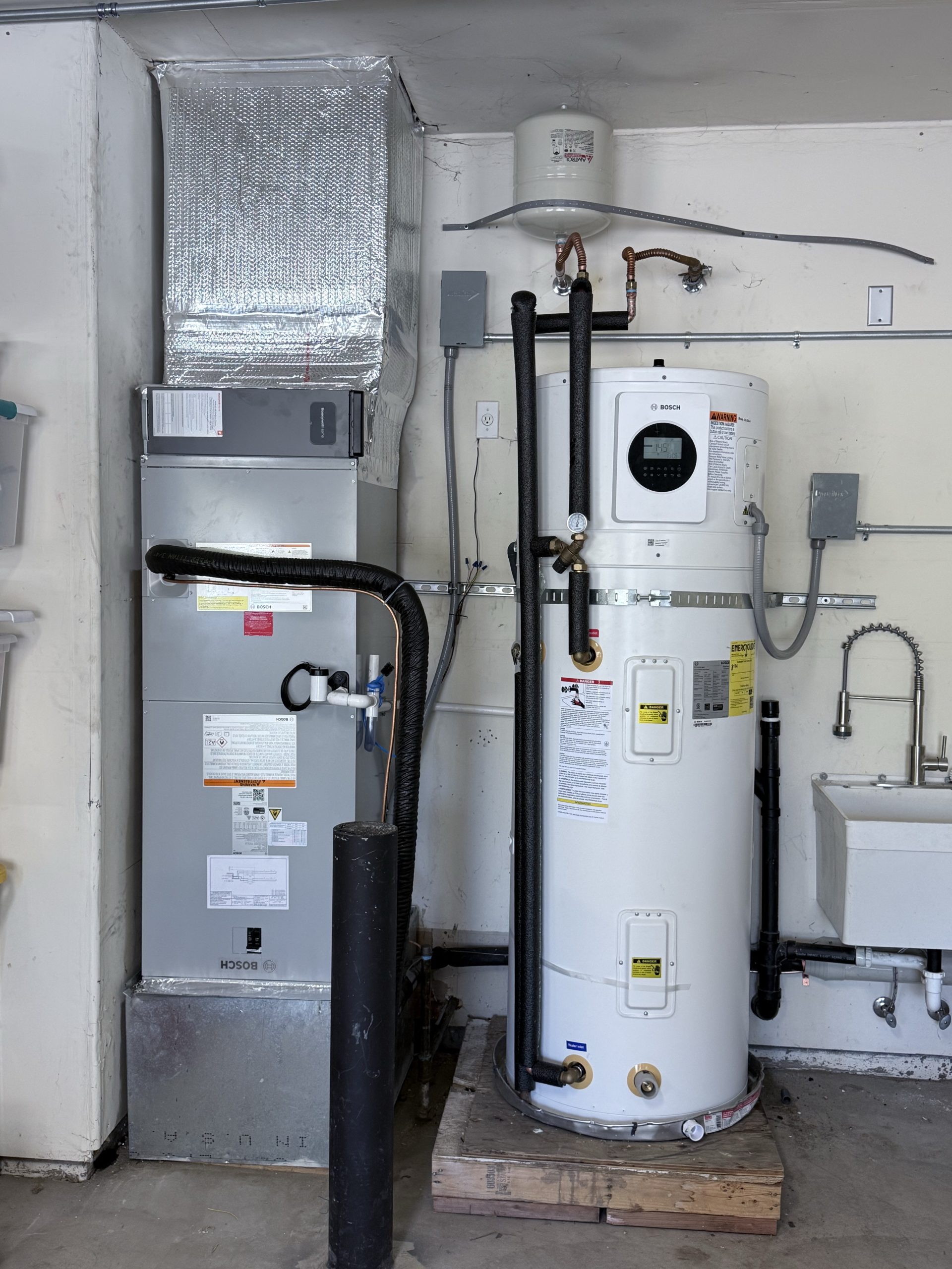 Bosch indoor air handler beside a hybrid electric water heater in Glenshire, Truckee