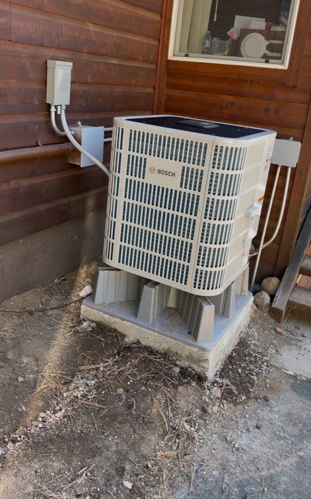 Outdoor Bosch inverter heat pump on raised supports and a concrete base in Truckee