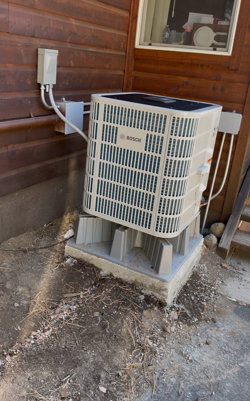 Outdoor Bosch inverter heat pump on raised supports and a concrete base in Truckee