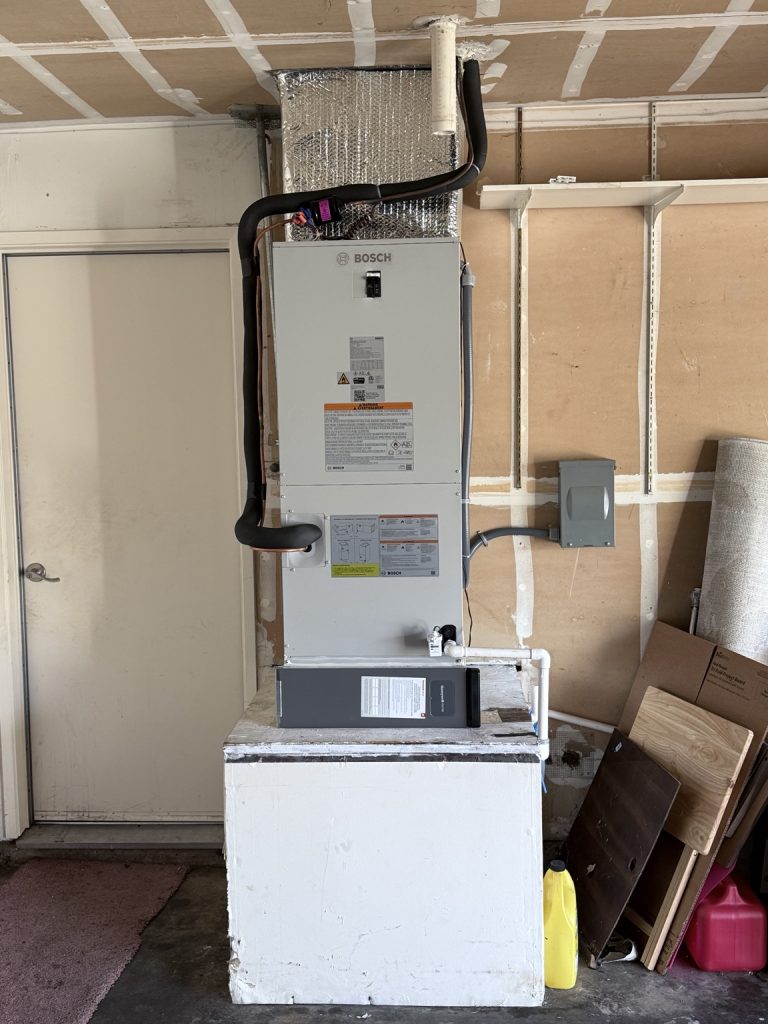 Bosch air handler installed in a Roseville garage for a heat pump system with auxiliary electric heat