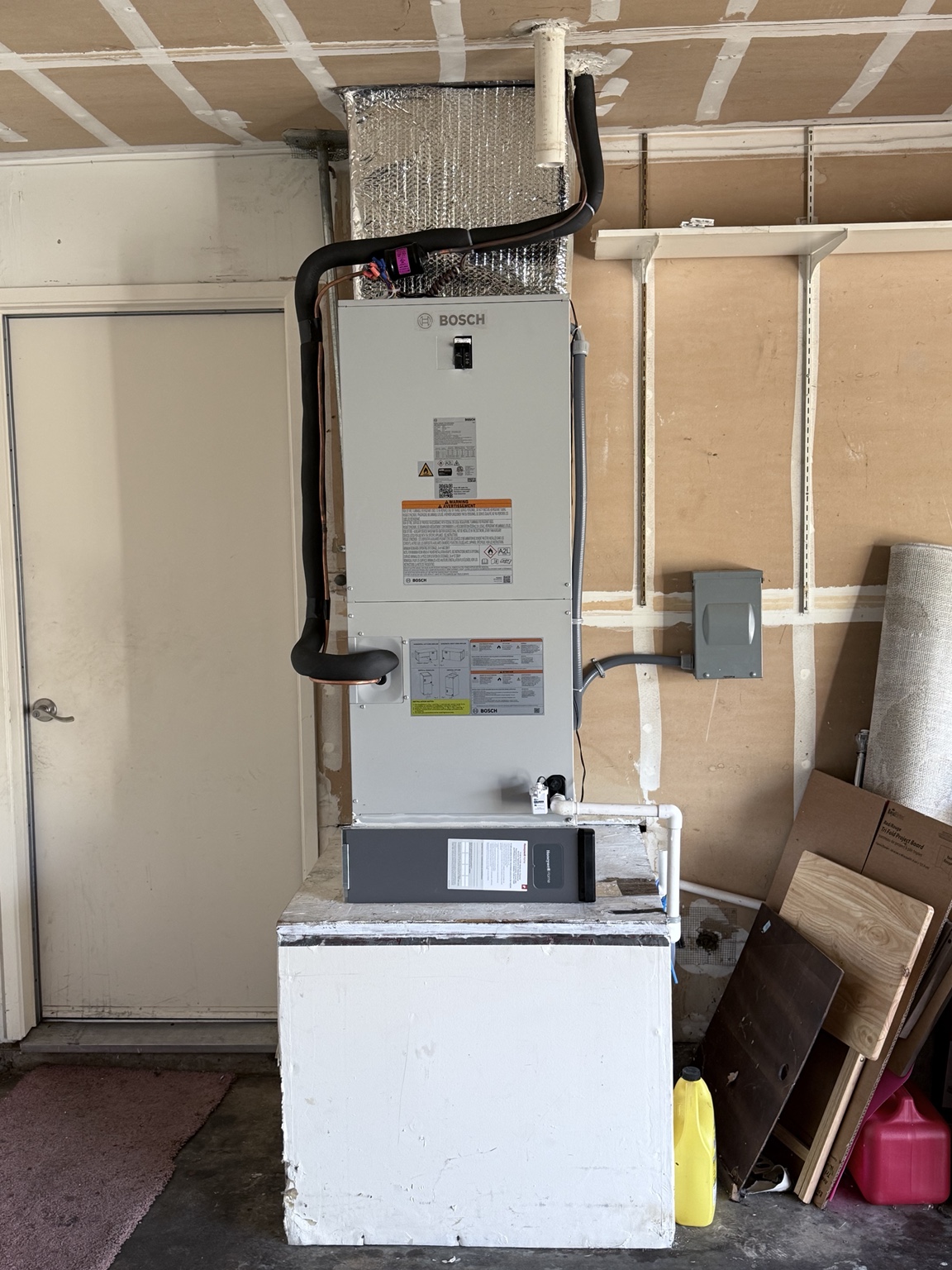 Bosch air handler installed in a Roseville garage for a heat pump system with auxiliary electric heat