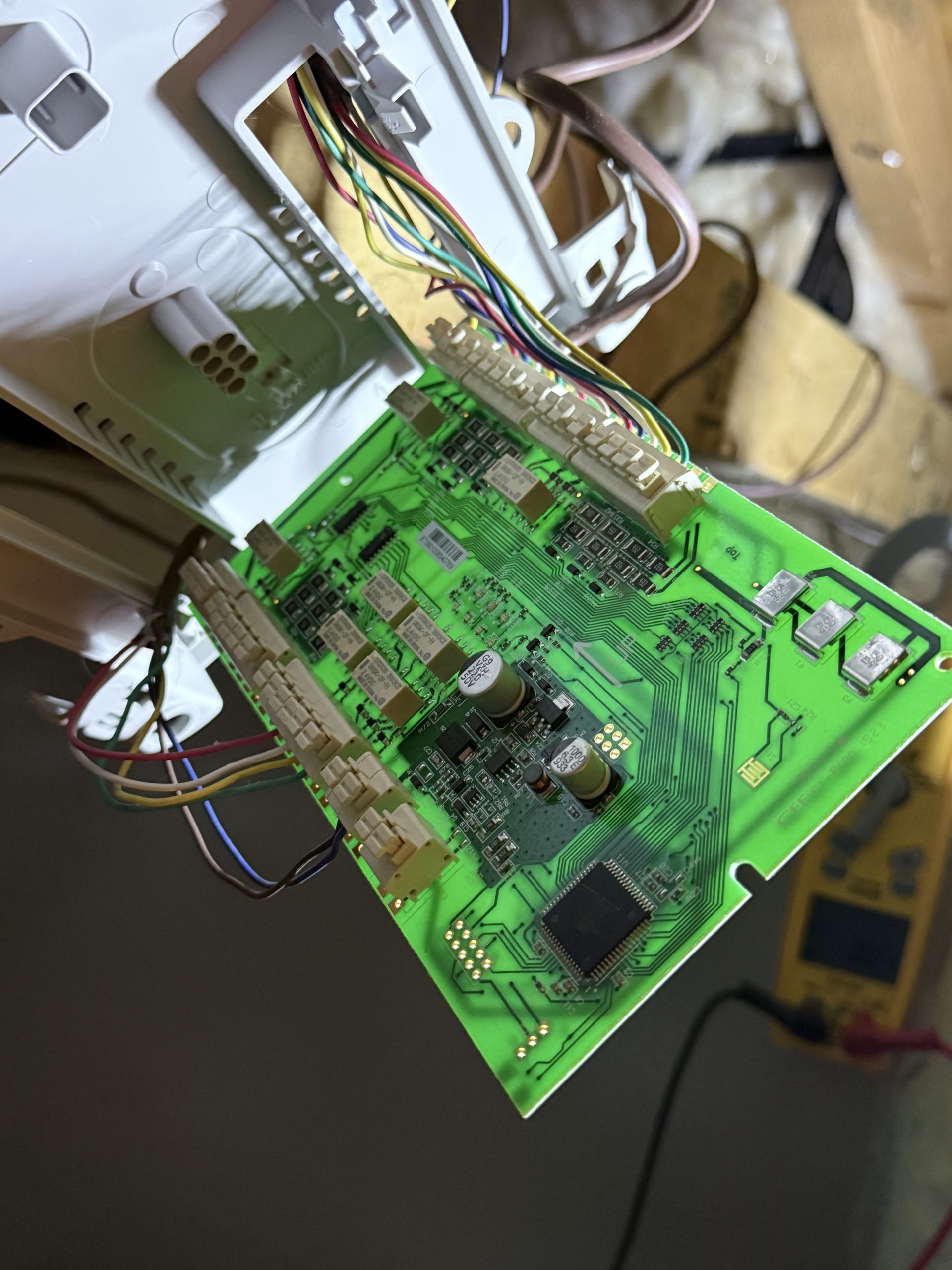 Exposed zone panel circuit board and wiring during furnace repair in Truckee