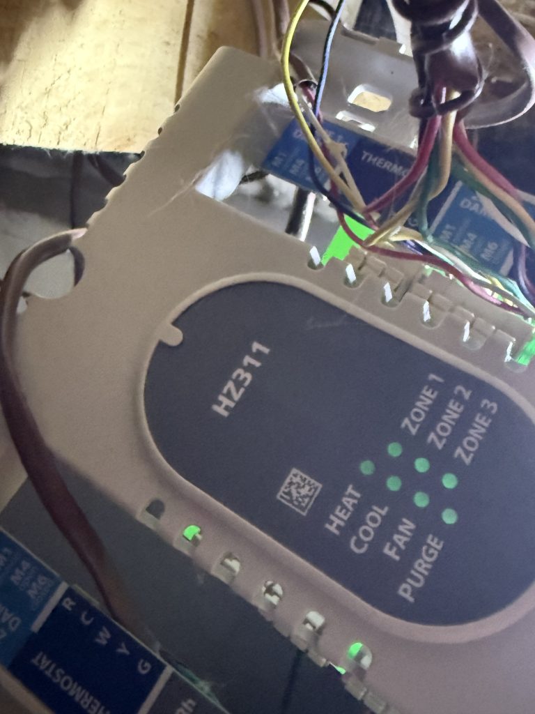 HZ311 zone control panel with wiring and illuminated indicators at the Truckee project