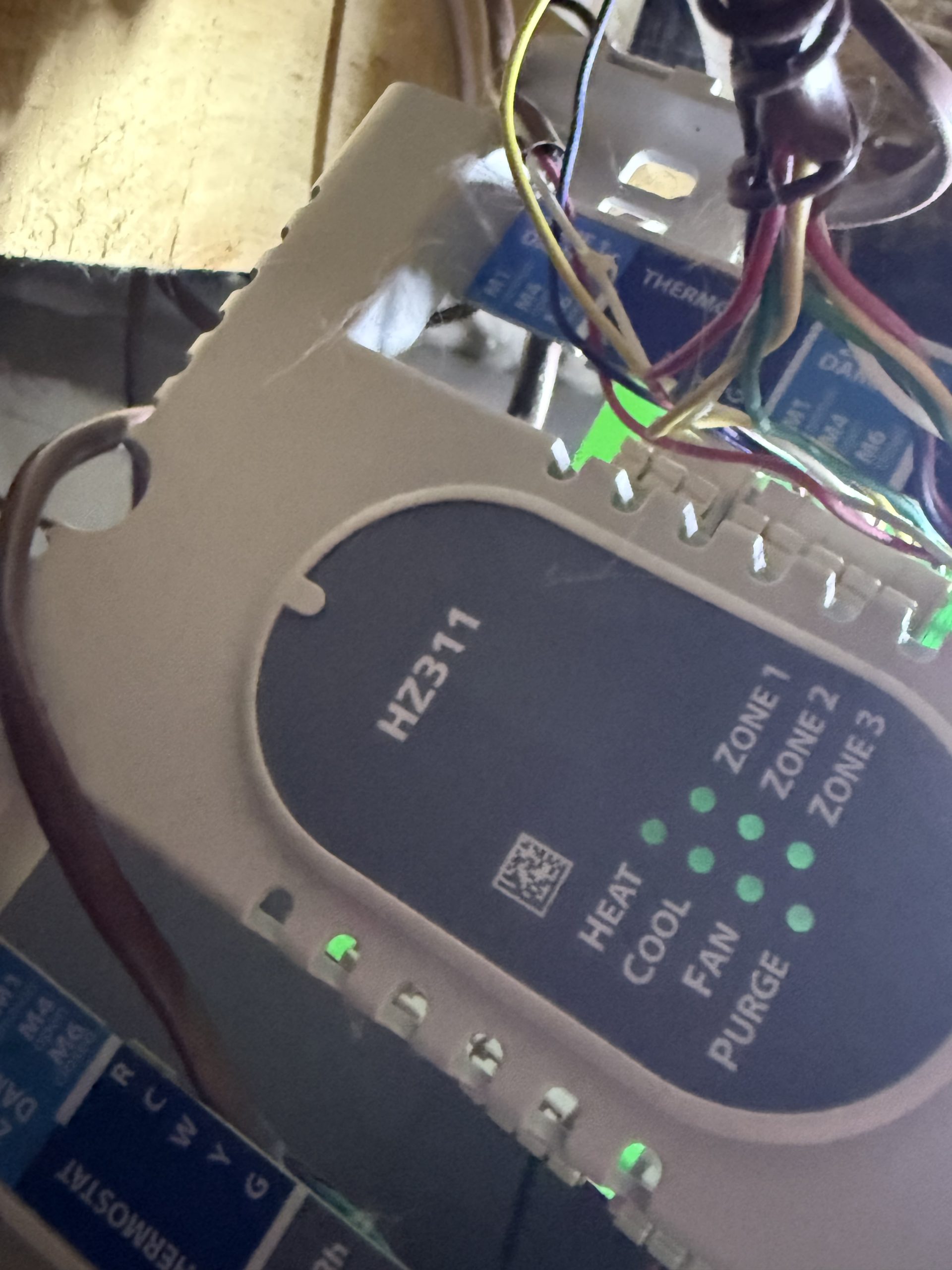 HZ311 zone control panel with wiring and illuminated indicators at the Truckee project