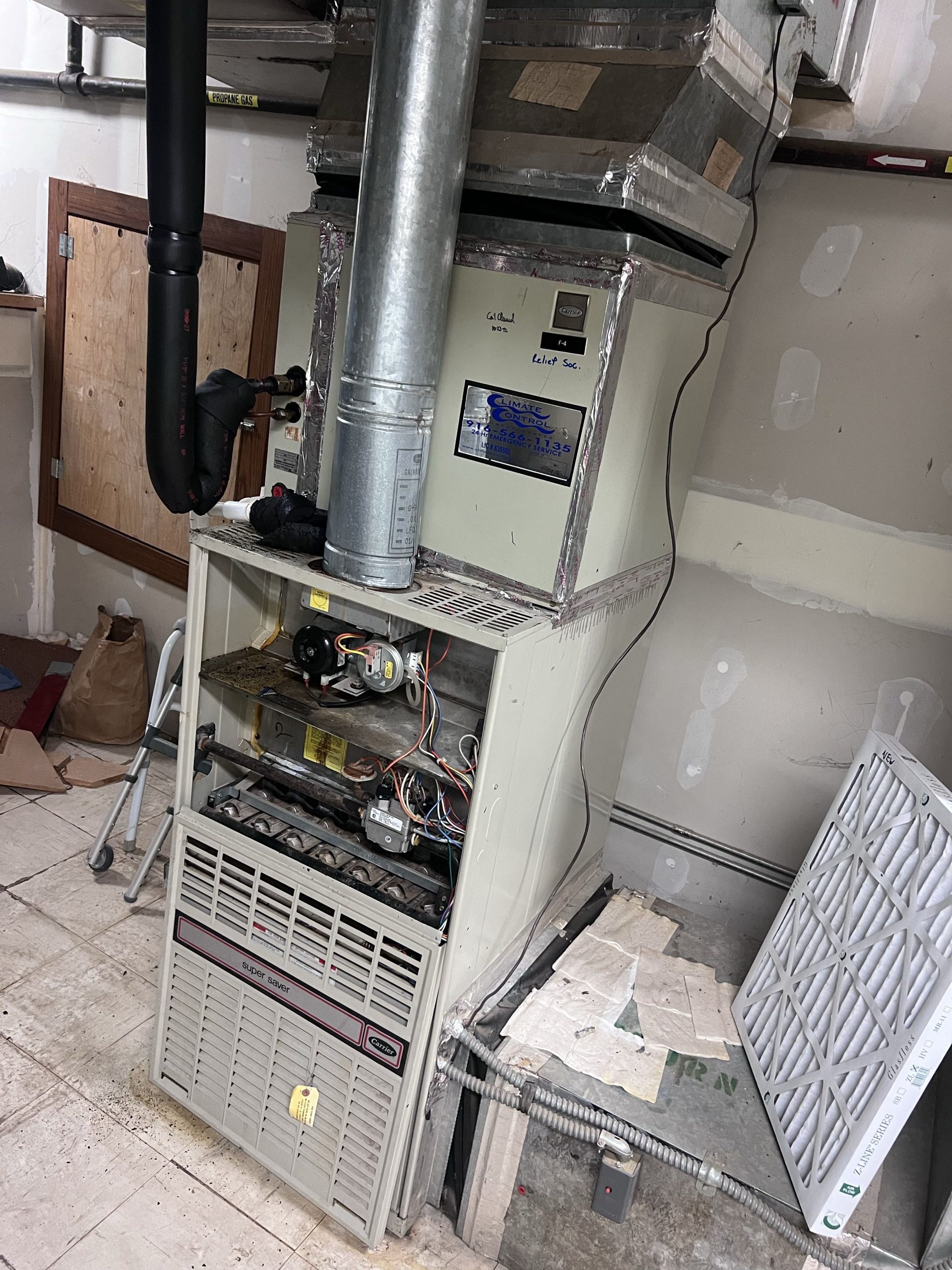 Carrier furnace with access panel removed during a no-heat repair in Lahontan, Truckee