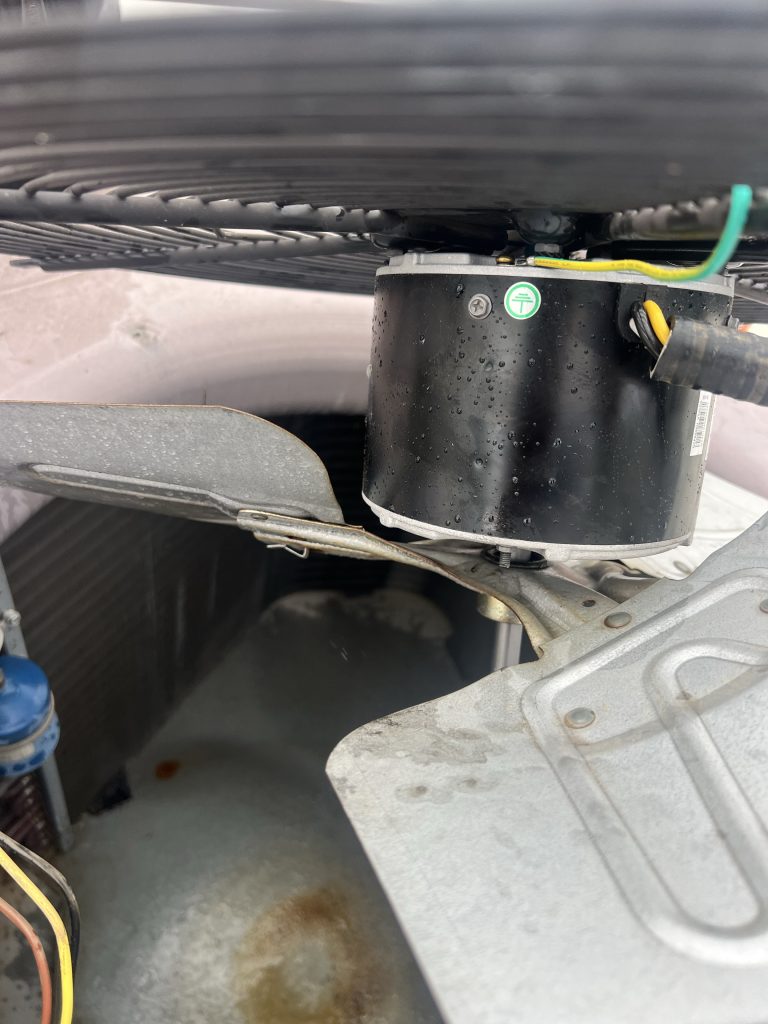 New condenser fan motor mounted with the fan blade during the Penryn AC repair