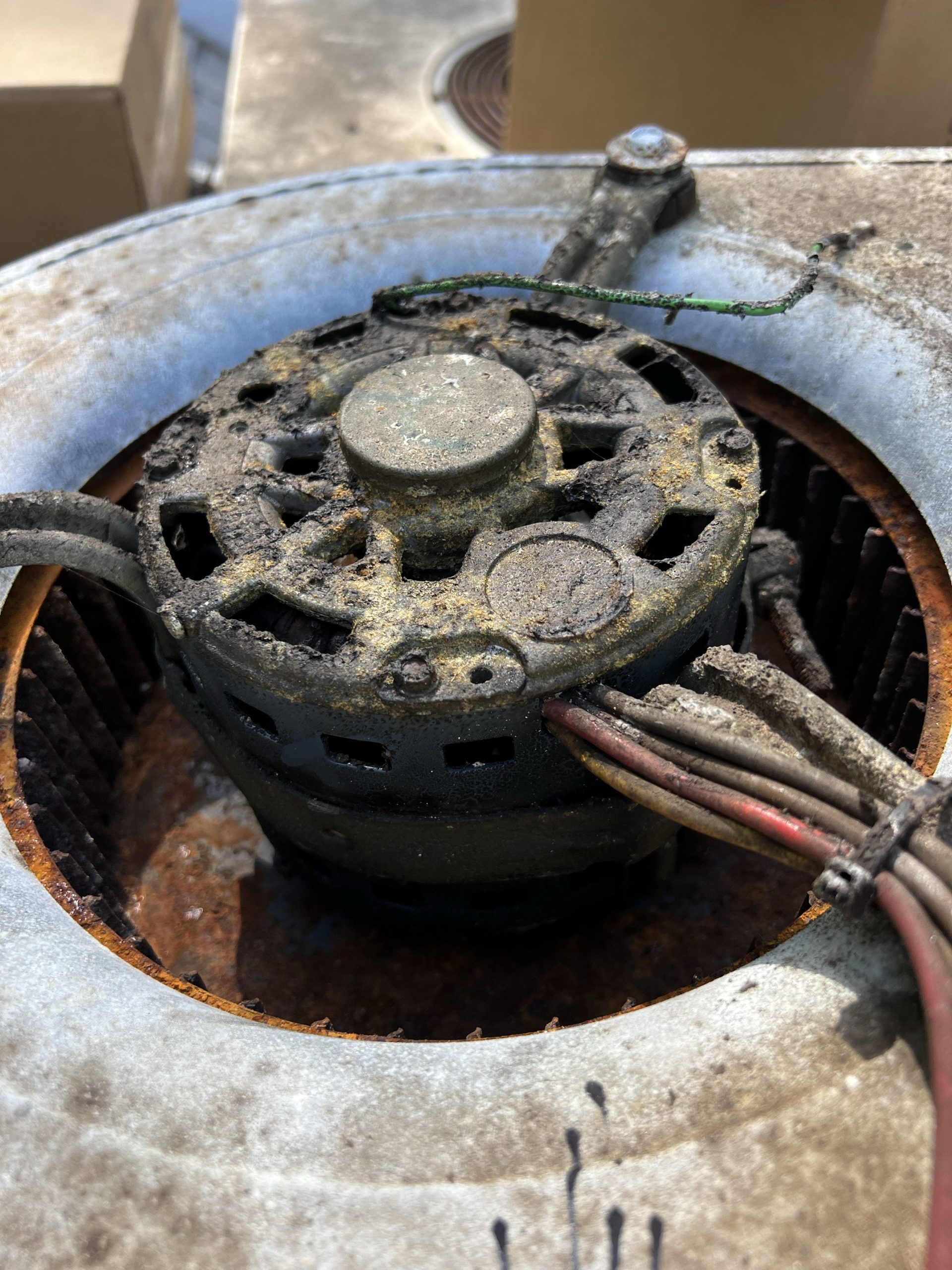 Old furnace blower motor with dust buildup before replacement in Roseville